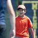 Chris Cho walks to celebrate with his doubles partner, Nathan Charles Grosh, after beating Barton 6-4 on Friday, July 12. Daniel Brenner I AnnArbor.com